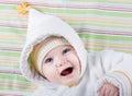 Baby with big blue eyes in warm hat and jacket Royalty Free Stock Photo