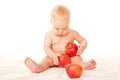 Baby with big red apples Royalty Free Stock Photo