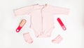 Baby birth concept. pink clothes for a newborn girl. Preparing for childbirth. baby care. Accessories for children. bodusuit and