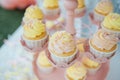 Baby birthday. French macaroons on a cake stand .Candy bar with macaron, cakes, cheesecakes, cake pops.