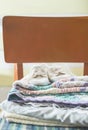 Baby blankets and shoes on chair Royalty Free Stock Photo