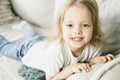 Baby with blond hair shows white teeth. Royalty Free Stock Photo