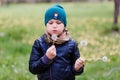 Baby blows off dandelion