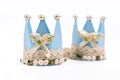 Baby blue cardoard paper crown decorated with lace and ribbons for children birthday party on white background Royalty Free Stock Photo