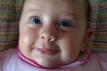 Baby with blue eyes laughing Royalty Free Stock Photo