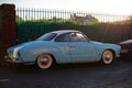 Baby blue VW Karmann Ghia vintage coupe car parked at the street