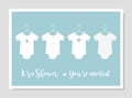 Baby Body Suits Clothes on Hangers. Pastel Baby Announcements and Shower Invitation Cards