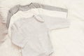 Baby Bodysuit Mockup. Styled Stock Photography. Clothes For A Boy. Jumpsuits, Rompers On A White Fur Carpet. Newborn Concept. Boy