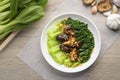 Baby Bok choy or chinese cabbage in mushroom vegetarian sauce with Shitake Mushrooms and fried garlic Royalty Free Stock Photo