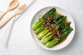 Baby Bok choy or chinese cabbage in oyster sauce with Shitake Mushrooms and fried garlic.Top view Royalty Free Stock Photo