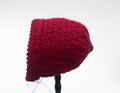 Baby bonnet knit berry color isolated Royalty Free Stock Photo