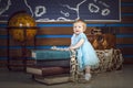 Baby with books and globe Royalty Free Stock Photo