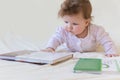 A baby with books. Royalty Free Stock Photo