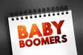 Baby boomers - demographic cohort following the Silent Generation and preceding Generation X, text concept on notepad