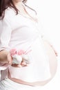 Baby bootees in hand of pregnant woman Royalty Free Stock Photo