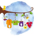 Baby born clothes hanging on the tree.