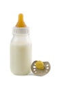 Baby bottle with milk and pacifier isolated Royalty Free Stock Photo