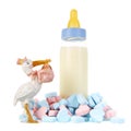 Baby bottle milk with stork and candy hearts Royalty Free Stock Photo