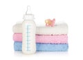 Baby bottle, pacifier and towels Royalty Free Stock Photo