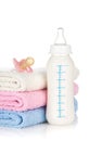 Baby bottle, pacifier and towels Royalty Free Stock Photo