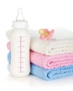 Baby bottle, pacifier and towels Royalty Free Stock Photo