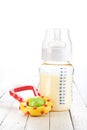 Baby bottle with toy Royalty Free Stock Photo