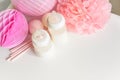 Baby bottles with breast milk with various festive paper decor. It`s a girl or baby birthday celebration concept. Royalty Free Stock Photo