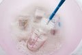 Baby bottles it was clear that a disinfectant in water cleaning solution with bottle brush Royalty Free Stock Photo