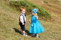 Baby boy and adorable child girl on grass. Summer green nature background Royalty Free Stock Photo