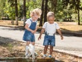 Baby boy and adorable child girl in park. Summer green nature . Royalty Free Stock Photo