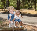 Baby boy and adorable child girl in park. Summer green nature . Royalty Free Stock Photo