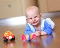 Angry baby boy learning to crawl annoyed Royalty Free Stock Photo