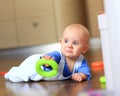 Angry baby boy learning to crawl annoyed Royalty Free Stock Photo