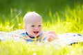 Baby boy with apple on family garden picnic Royalty Free Stock Photo