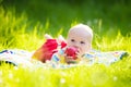 Baby boy with apple on family garden picnic Royalty Free Stock Photo