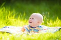 Baby boy with apple on family garden picnic Royalty Free Stock Photo