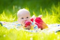 Baby boy with apple on family garden picnic Royalty Free Stock Photo