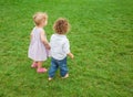 Baby boy and baby girl in the park