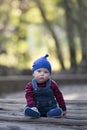 Baby boy with beanie on a glowing Autumn day Royalty Free Stock Photo