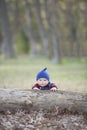 Baby boy with beanie on a glowing Autumn day