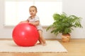 Baby boy with big red ball Royalty Free Stock Photo