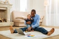 Happy father amusing his crying son Royalty Free Stock Photo