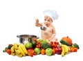 Baby boy in chef hat with cooking pan and vegetables Royalty Free Stock Photo