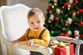 Baby boy with chubby cheeks smiles at Christmas Royalty Free Stock Photo