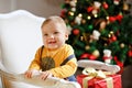 Baby boy with chubby cheeks smiles at Christmas Royalty Free Stock Photo