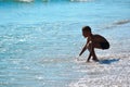 A boy plays in the sea. Enjoy a vacation in the tropics.