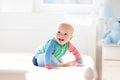 Baby boy crawling on bed Royalty Free Stock Photo