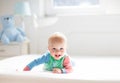 Baby boy crawling on bed Royalty Free Stock Photo