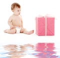 Baby boy in diaper with big gift box Royalty Free Stock Photo