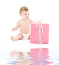 Baby boy in diaper with big gift box Royalty Free Stock Photo